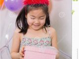 Little Birthday Gifts for Her Little Girl with Gift Box at Her Birthday Party Stock